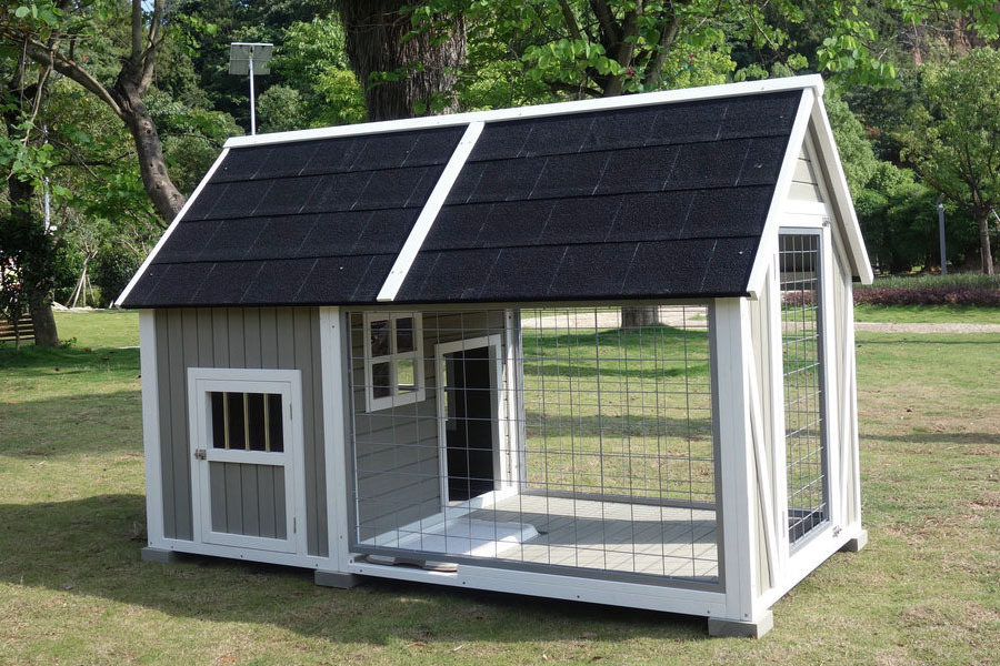 Picture of a dog house with shaded area in front of it